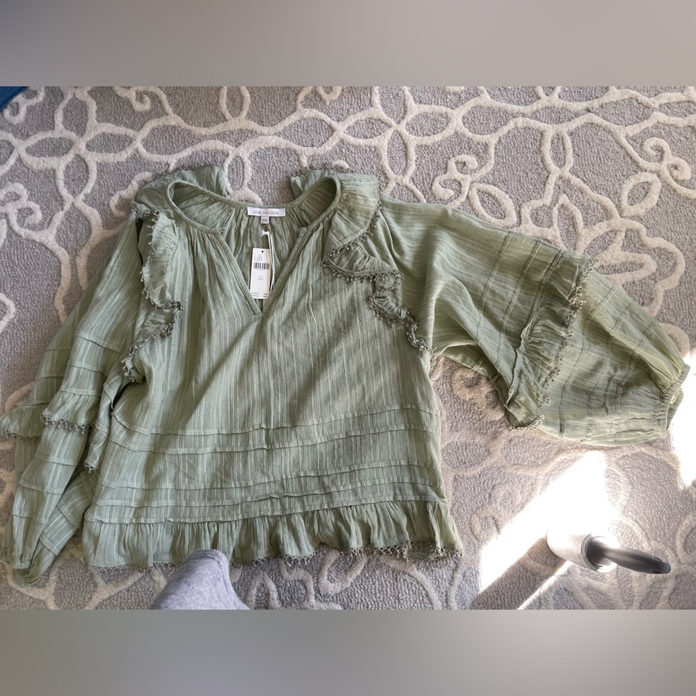 Anthropologie Love the Label green ruffle peasant top.